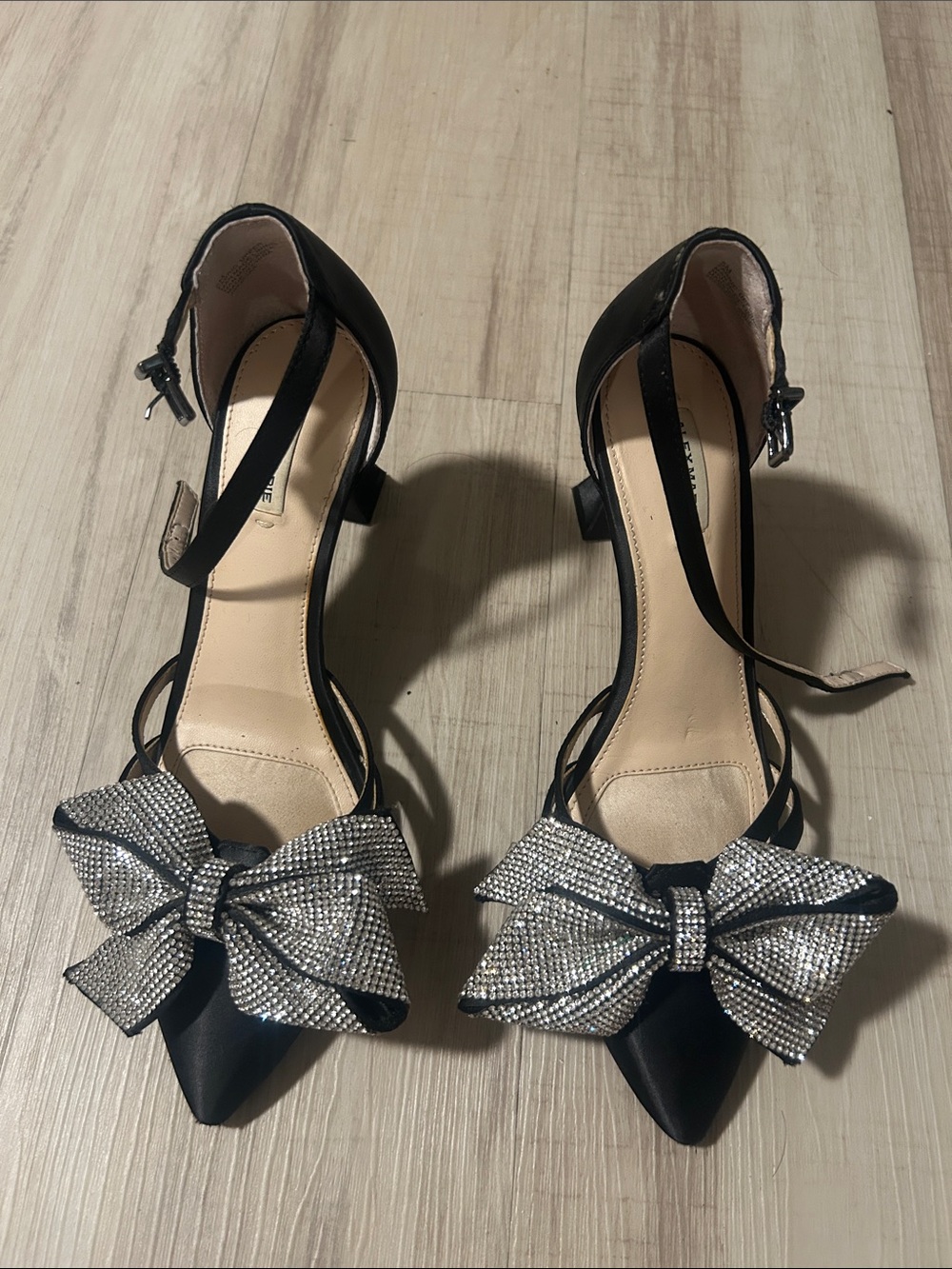 Alex Marie Black Pointed Ankle-Strap Heels with Crystal Bow Accent